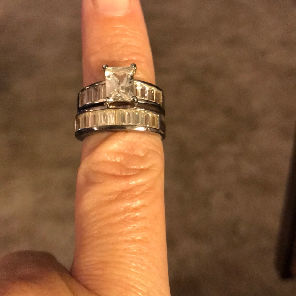 Lab created white topaz and silver wedding rings.